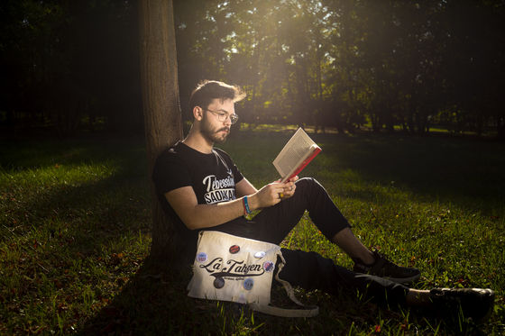 Young Man reading book.