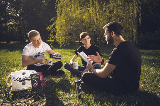 Group of young man enhoy talking while drinking tea.